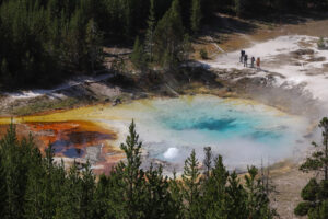 Hikers look at Hot spring in Yellowstone Image: NPS / A. Falgoust