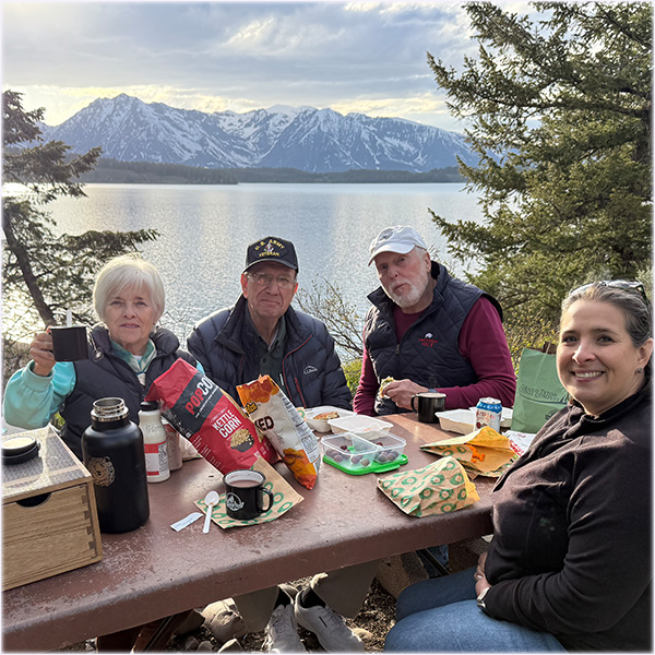 Guests with Guides of Jackson Hole enjoy a picnic near Jackson Lake