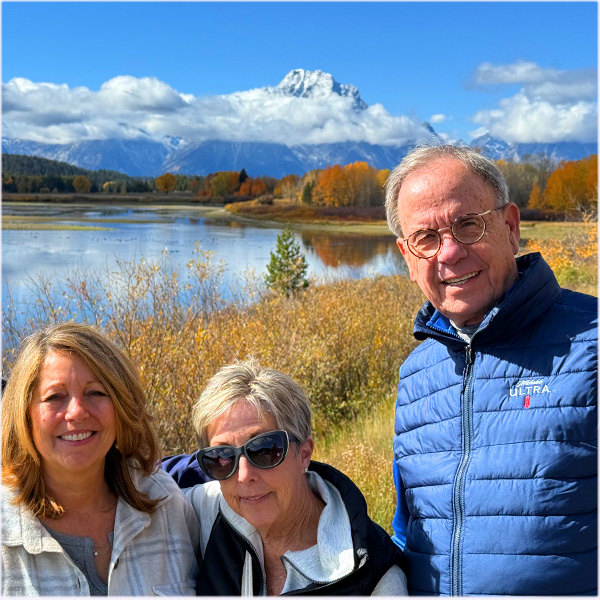 Visitors at Oxbow bend in Grand Teton National Park on a sunny fall morning.